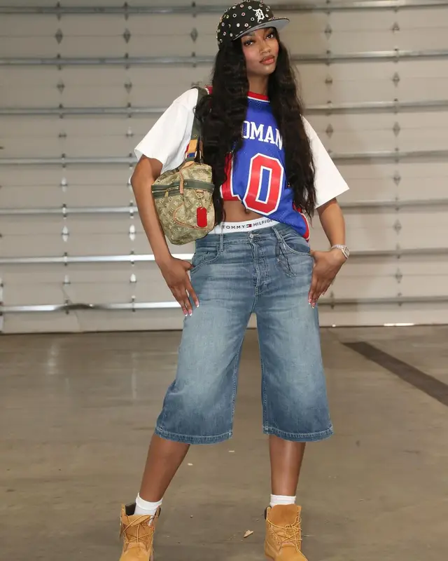 Angel Reese outfit in Mitchell & Ness, Cartier, and Chanel, 2024