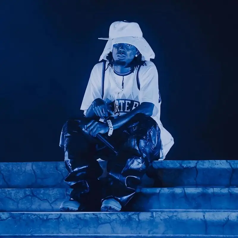 Playboi Carti outfit in Mitchell & Ness, Timberland, and New Era, 2024