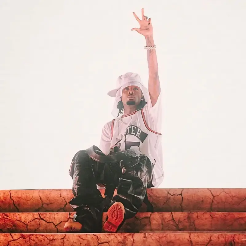 Playboi Carti outfit in Mitchell & Ness, Timberland, and New Era, 2024