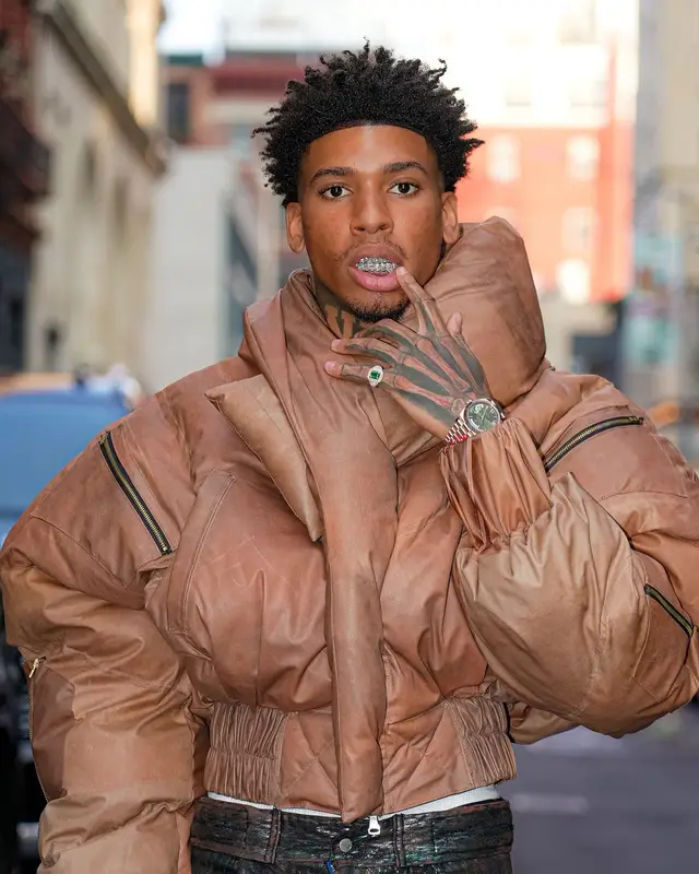 NLE Choppa outfit in Louis Vuitton, Rolex, and Timberland, 2024