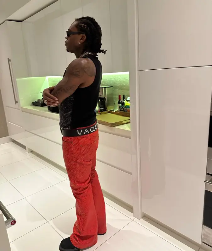 Gunna outfit in Versace, Gucci, and H&M, 2024