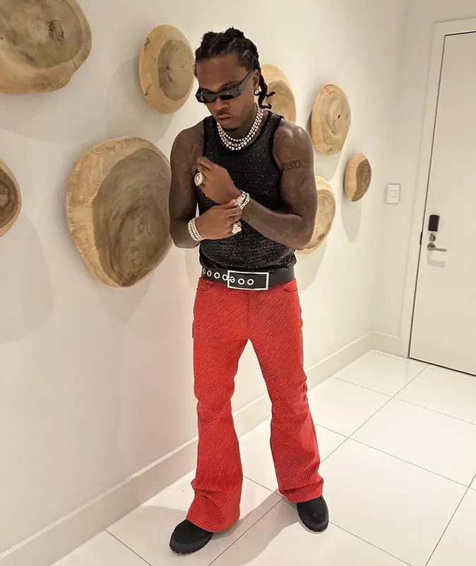 Gunna outfit in Versace, Gucci, and H&M, 2024