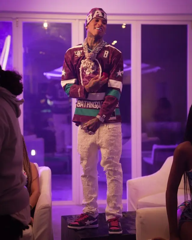 NLE Choppa outfit in Mitchell & Ness, Embellish NYC, and Bape, 2024