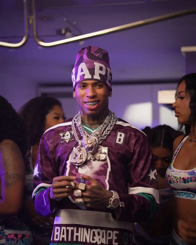 NLE Choppa outfit in Mitchell & Ness, Embellish NYC, and Bape, 2024