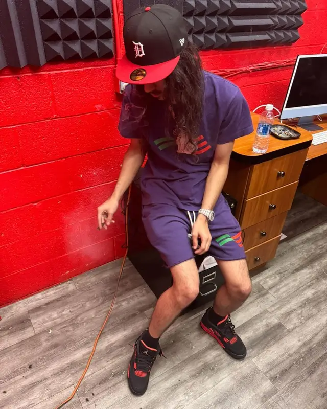BabyTron outfit in Denim Tears, Jordan, and New Era, 2024