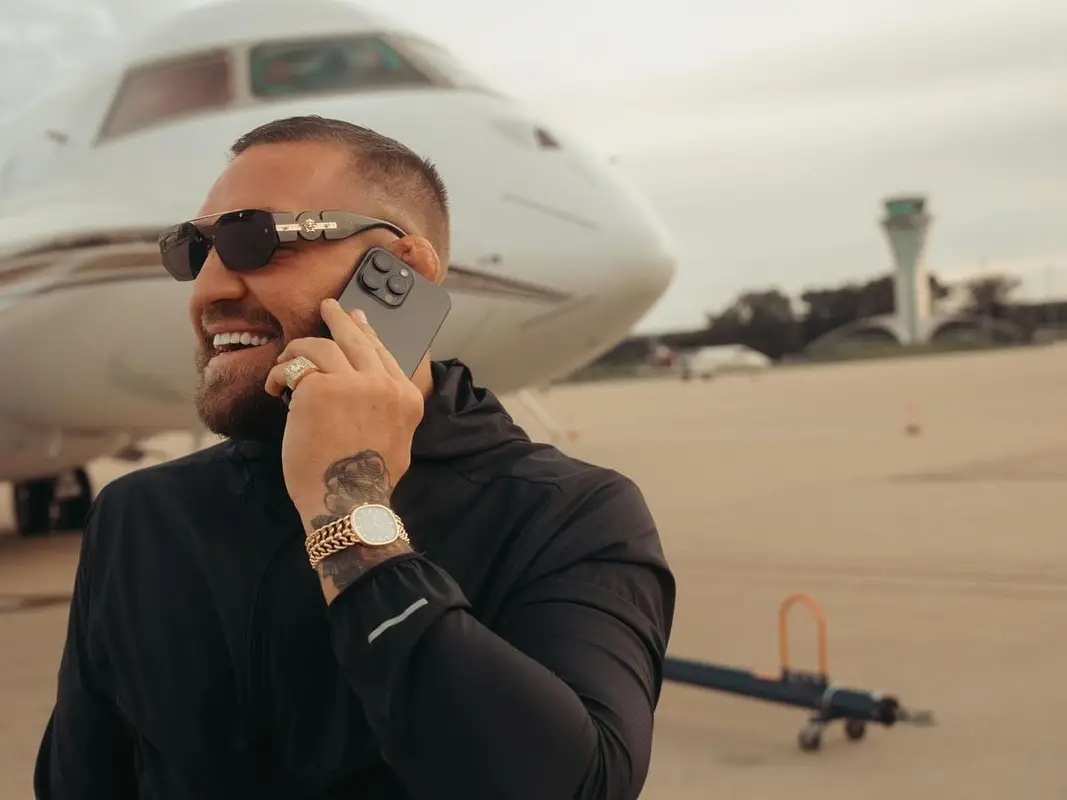 Conor McGregor outfit in Nike, Patek Philippe, and Versace, 2024