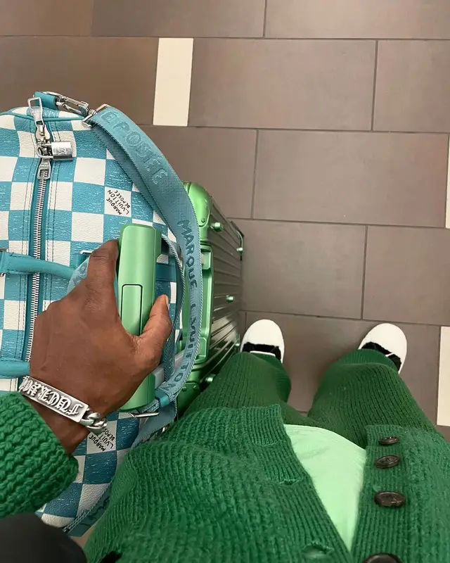 Saint JHN outfit in Maison Margiela, Marni, and Rimowa, 2024