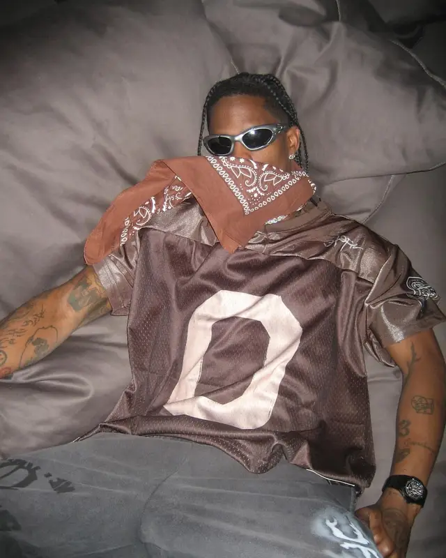 Travis Scott outfit in Travis Scott Merch, Audemars Piguet, and Oakley, 2024
