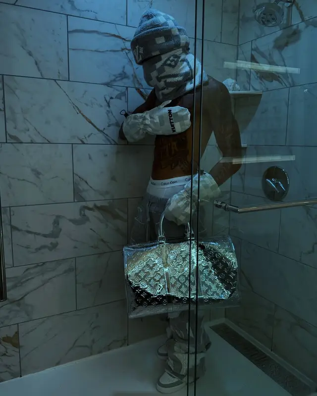 NLE Choppa outfit in Who Decides War, Louis Vuitton, and Calvin Klein, 2024
