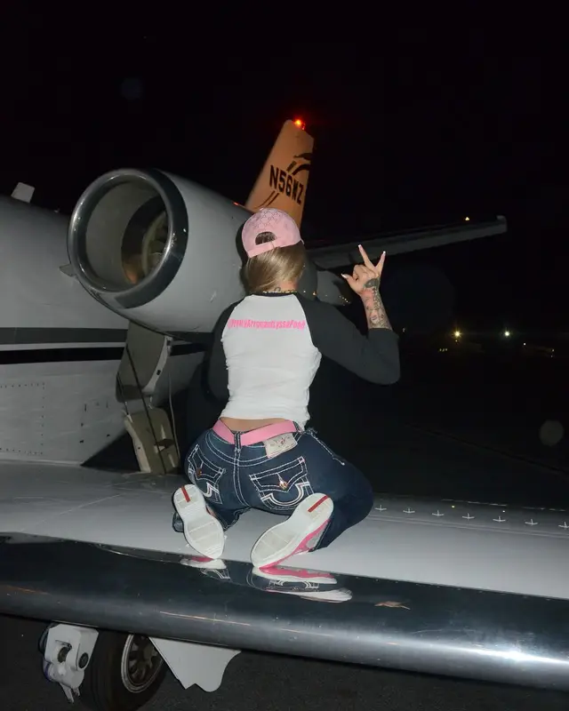 Latto outfit in True Religion, Prada, and Gucci, 2024