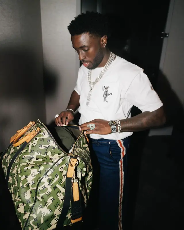 Lil Dann outfit in Wales Bonner, Goyard, and Louis Vuitton, 2024