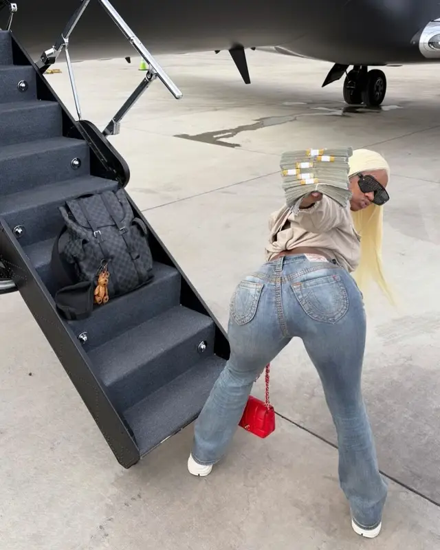 Sexyy Red outfit in True Religion, Chanel, and Dior, 2024