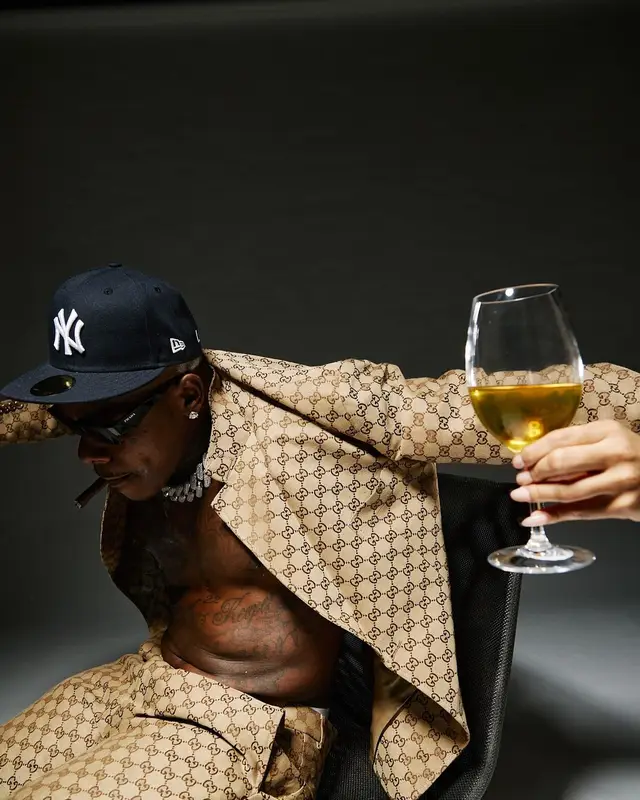 DaBaby outfit in Gucci, Prada, and New Era, 2024