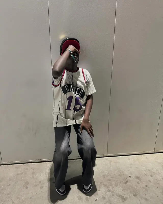 Dabo outfit in Mitchell & Ness, Levi’s, and Playboi Carti Merch, 2024