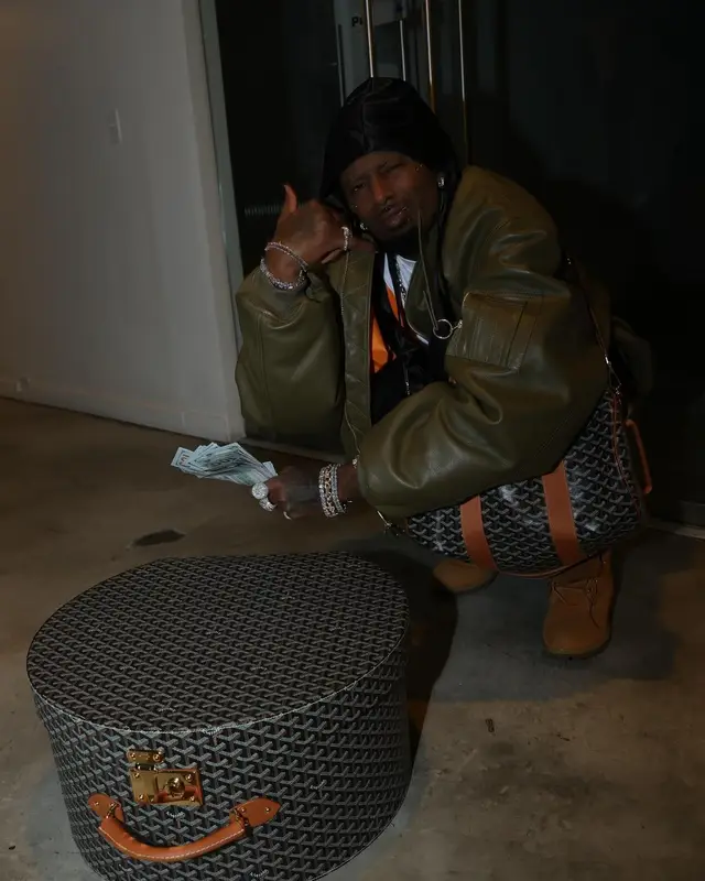 Playboi Carti outfit in Timberland and Goyard, 2024