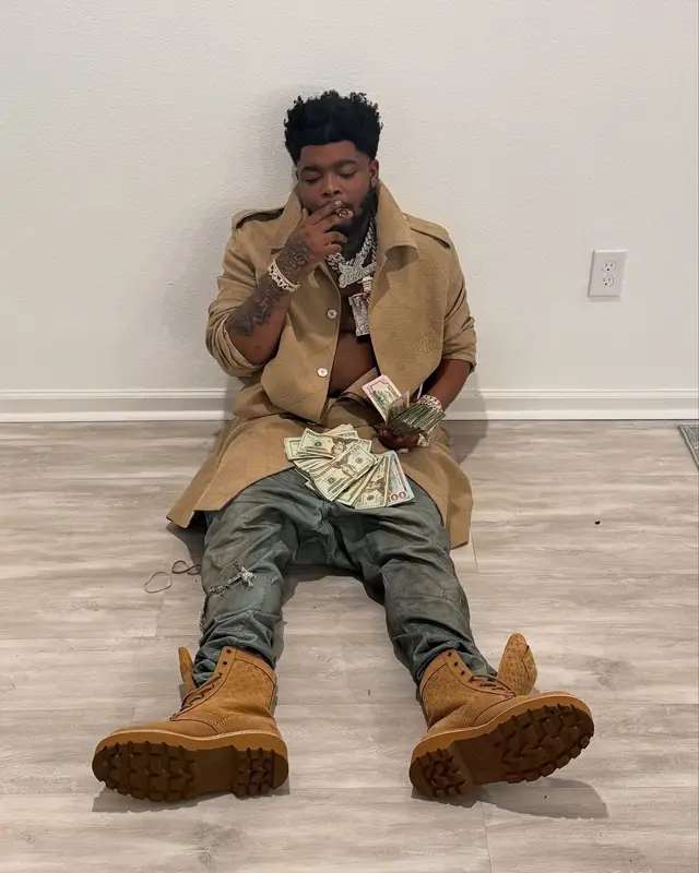 BossMan Dlow outfit in Louis Vuitton and Purple Brand, 2024