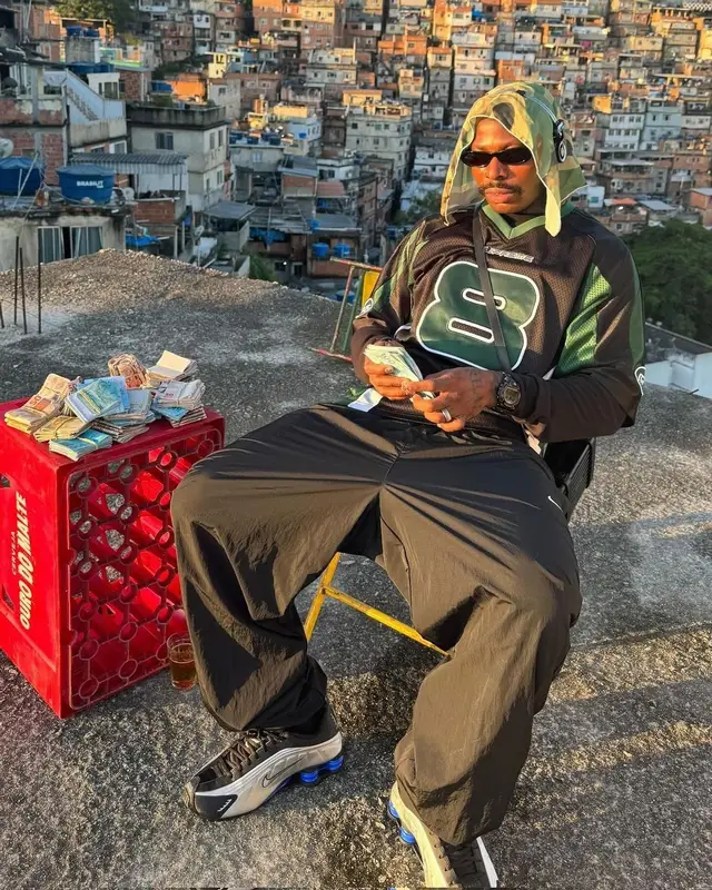 Asake outfit in Supreme, Nike, and Martine Rose, 2025