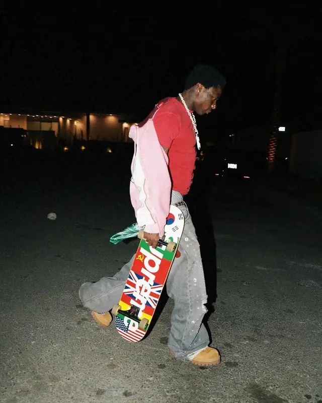 Asake outfit in Vintage, Supreme, and Golden Goose, 2025
