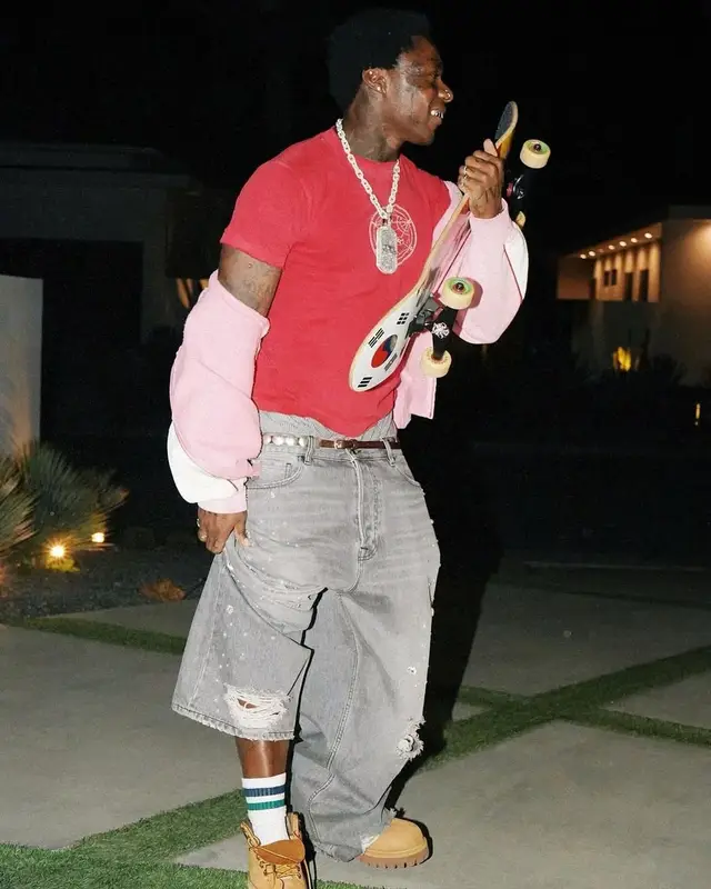 Asake outfit in Vintage, Supreme, and Golden Goose, 2025