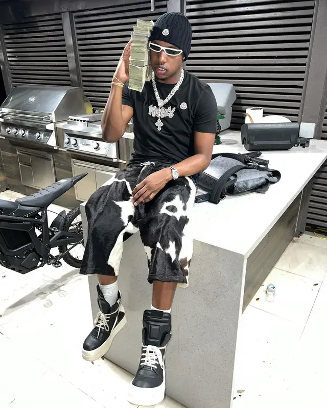 Rob49 outfit in Louis Vuitton, Rick Owens, and Moncler, 2024