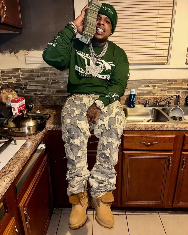 Finesse2tymes outfit in Timberland, Louis Vuitton, and Supreme, 2025