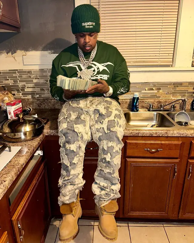 Finesse2tymes outfit in Timberland, Louis Vuitton, and Supreme, 2025