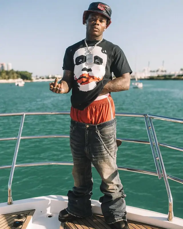 Asake outfit in Vintage, Balenciaga, and Chanel, 2025