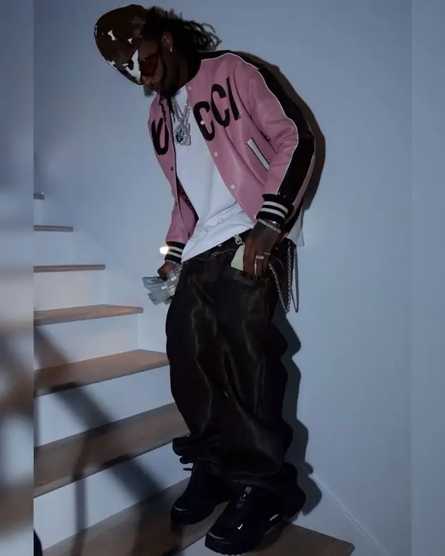 Playboi Carti outfit in Gucci, Nike, and Tom Ford, 2025