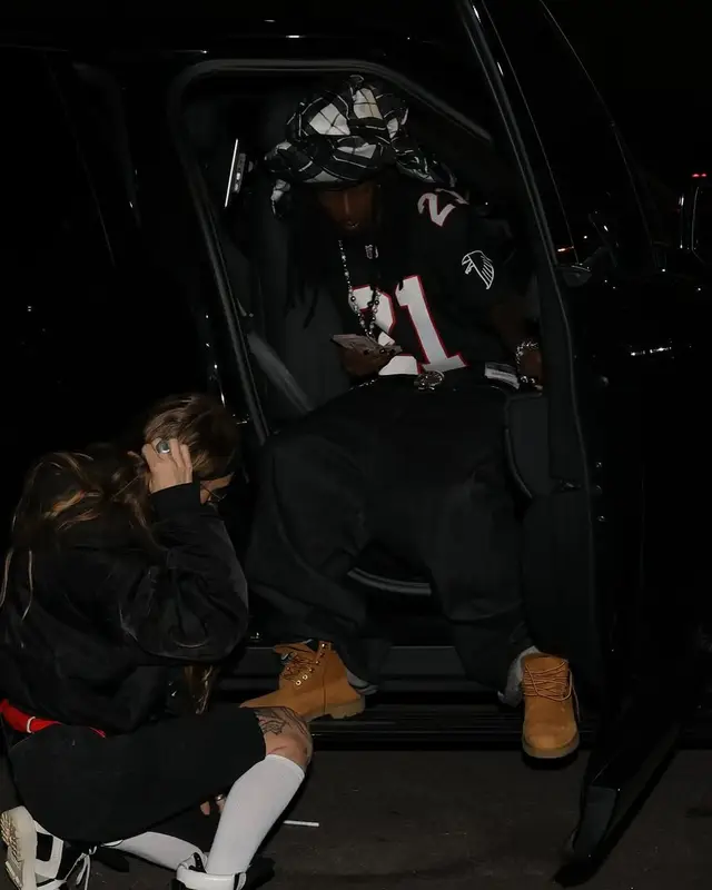 Playboi Carti outfit in Mitchell & Ness, Timberland, and Chrome Hearts, 2025