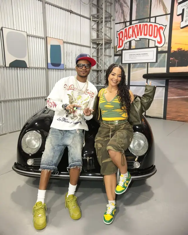 Chow Lee outfit in Rolex, Ray-Ban, and Playboi Carti Merch, 2025