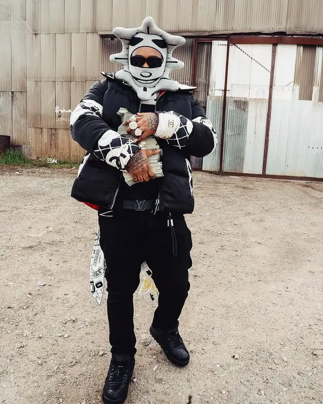BossMan Dlow outfit in Louis Vuitton, Celine, and Glo Gang, 2025