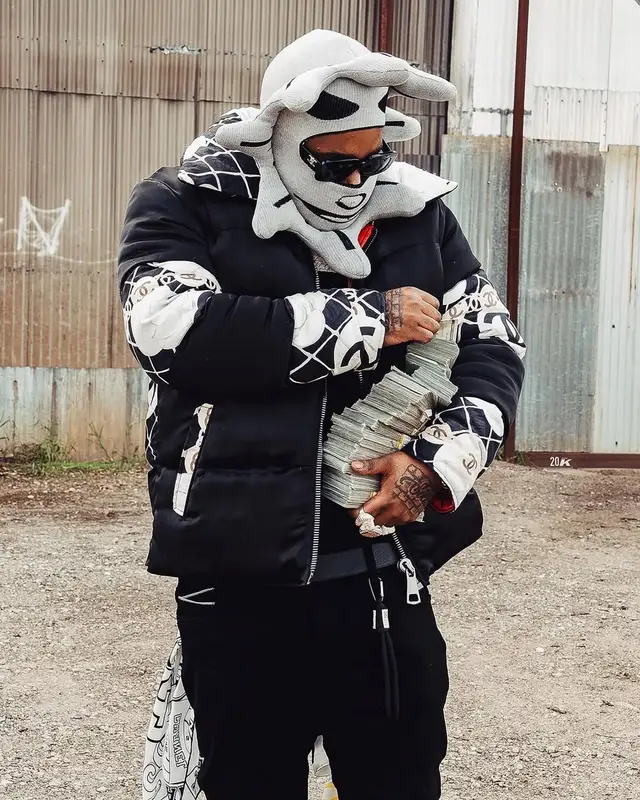 BossMan Dlow outfit in Louis Vuitton, Celine, and Glo Gang, 2025