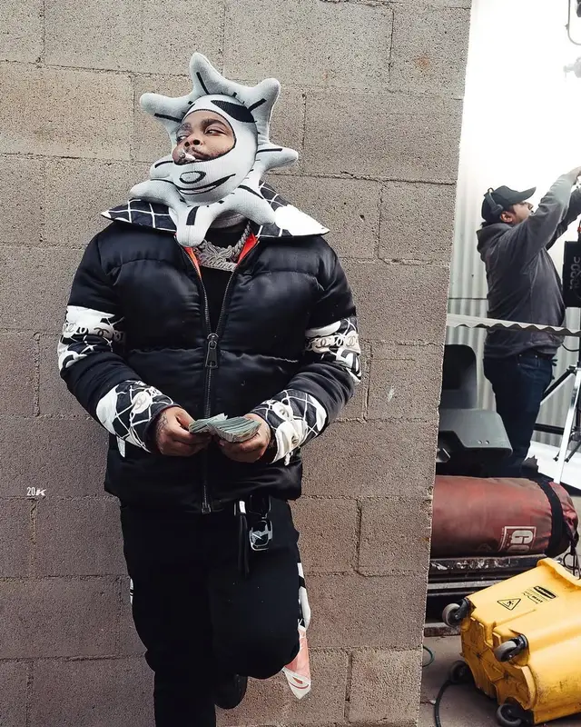 BossMan Dlow outfit in Louis Vuitton, Celine, and Glo Gang, 2025