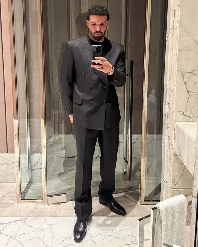 Drake outfit in Louis Vuitton, Tom Ford, and Cartier, 2025