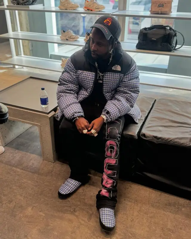 Popcaan outfit in Supreme, Balenciaga, and The North Face, 2025
