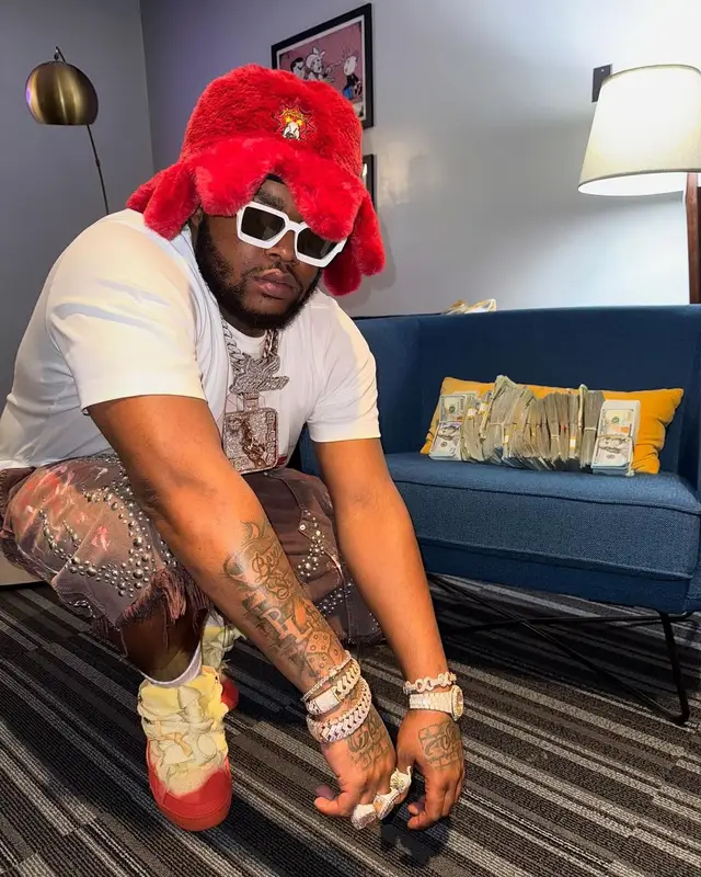 BossMan Dlow outfit in Lanvin, Louis Vuitton, and Glo Gang, 2025