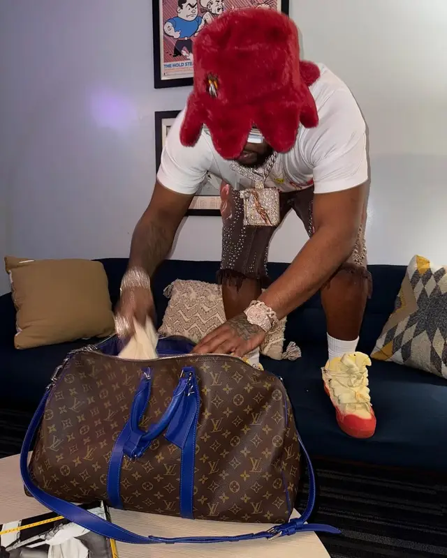 BossMan Dlow outfit in Lanvin, Louis Vuitton, and Glo Gang, 2025