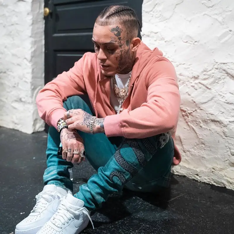 Lil Skies outfit in True Religion, Amiri, and Nike, 2025