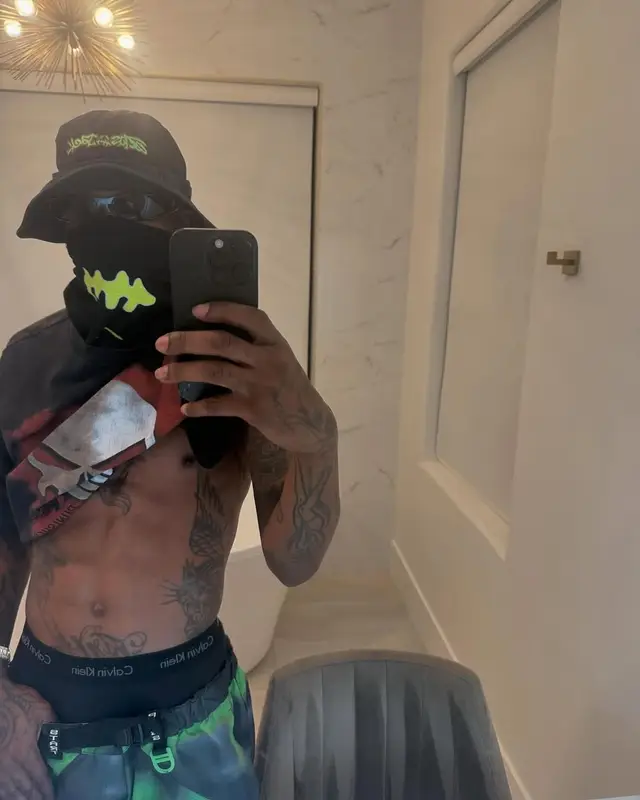 Travis Scott outfit in Nike, Travis Scott Merch, and Calvin Klein, 2025