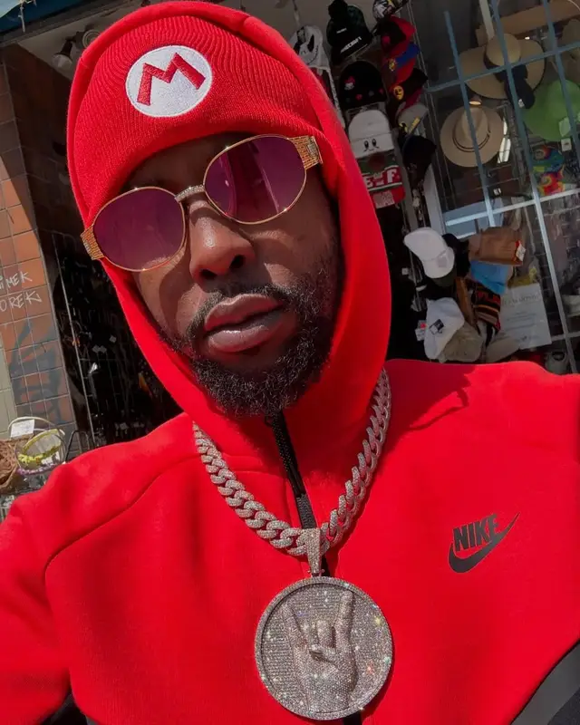 Popcaan outfit in Nike and Super Mario Merch, 2025