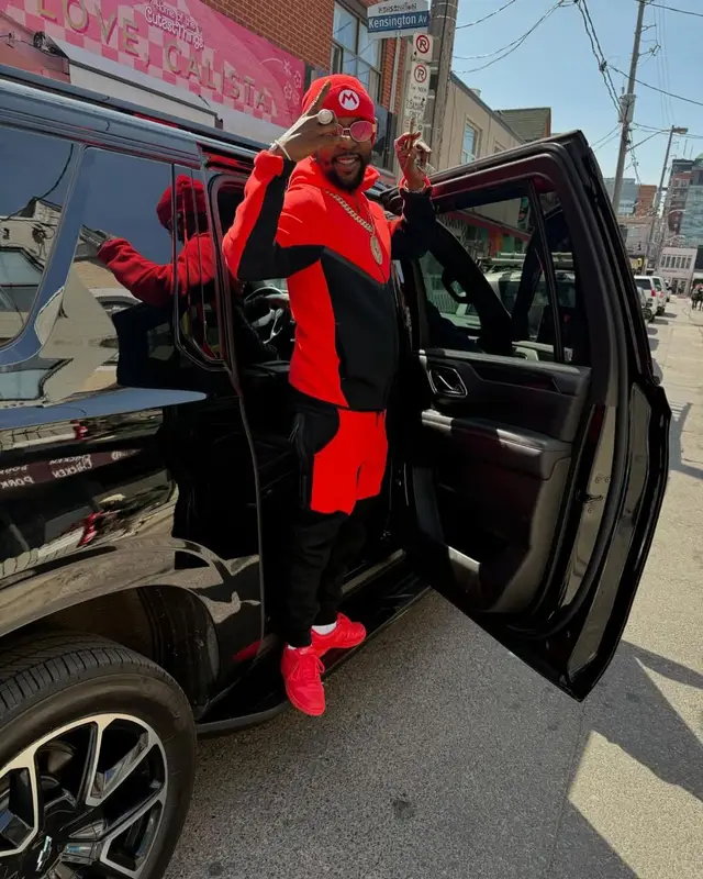 Popcaan outfit in Nike and Super Mario Merch, 2025