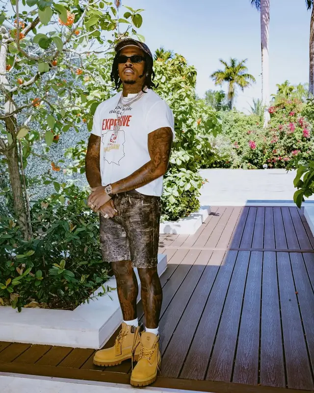 Gunna outfit in Patek Philippe, Prada, and Acne Studios, 2025