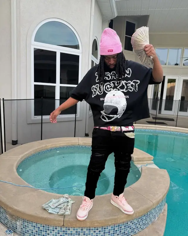 YN Jay outfit in Amiri, Louis Vuitton, and Supreme, 2025