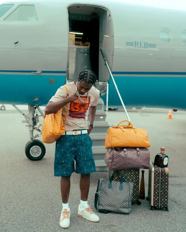 Lil Tjay outfit in Louis Vuitton, Goyard, and Tyler The Creator Merch, 2025