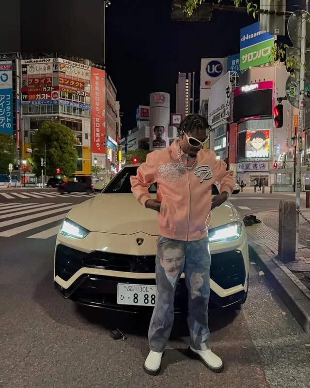 Lil Tjay outfit in Who Decides War, Audemars Piguet, and Acne Studios, 2025