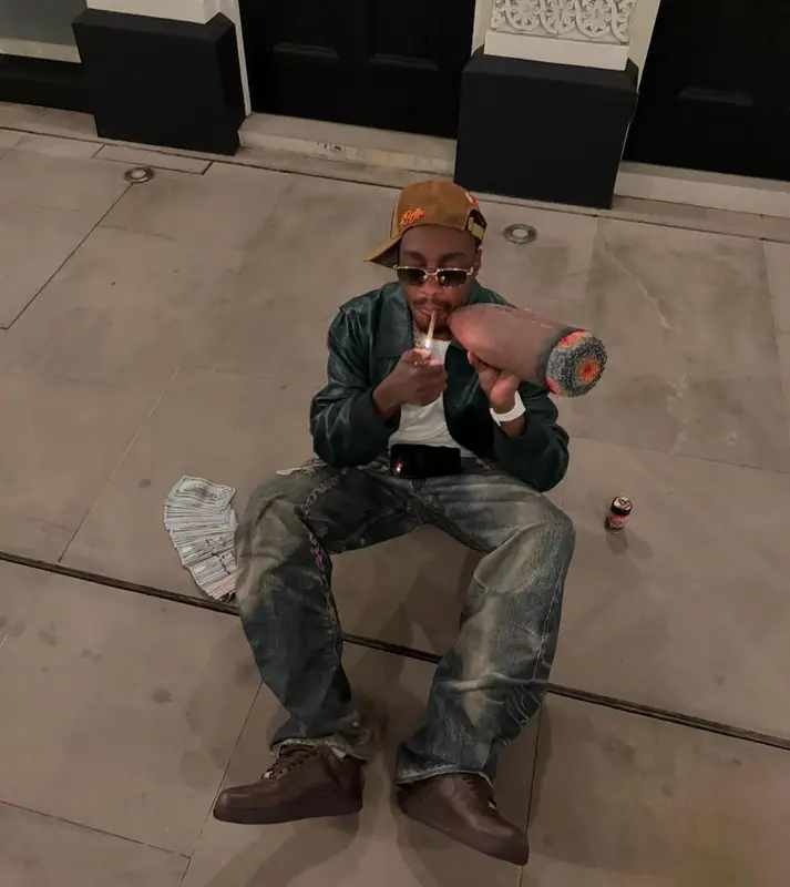 Lil Tjay outfit in Loewe, Louis Vuitton, and Richard Mille, 2025