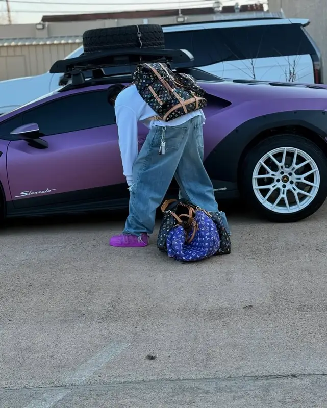 Travis Scott outfit in Balenciaga, Louis Vuitton, and Takashi Murakami, 2025