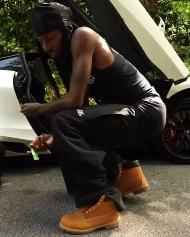 Playboi Carti outfit in Cough Syrup, Balenciaga, and Timberland, 2025