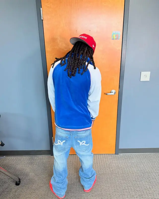 Kai Cenat outfit in Supreme, New Era, and MLB, 2025