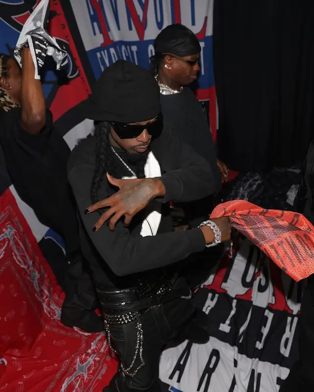 Playboi Carti outfit in Emporio Armani, Chrome Hearts, and Saint Laurent, 2025